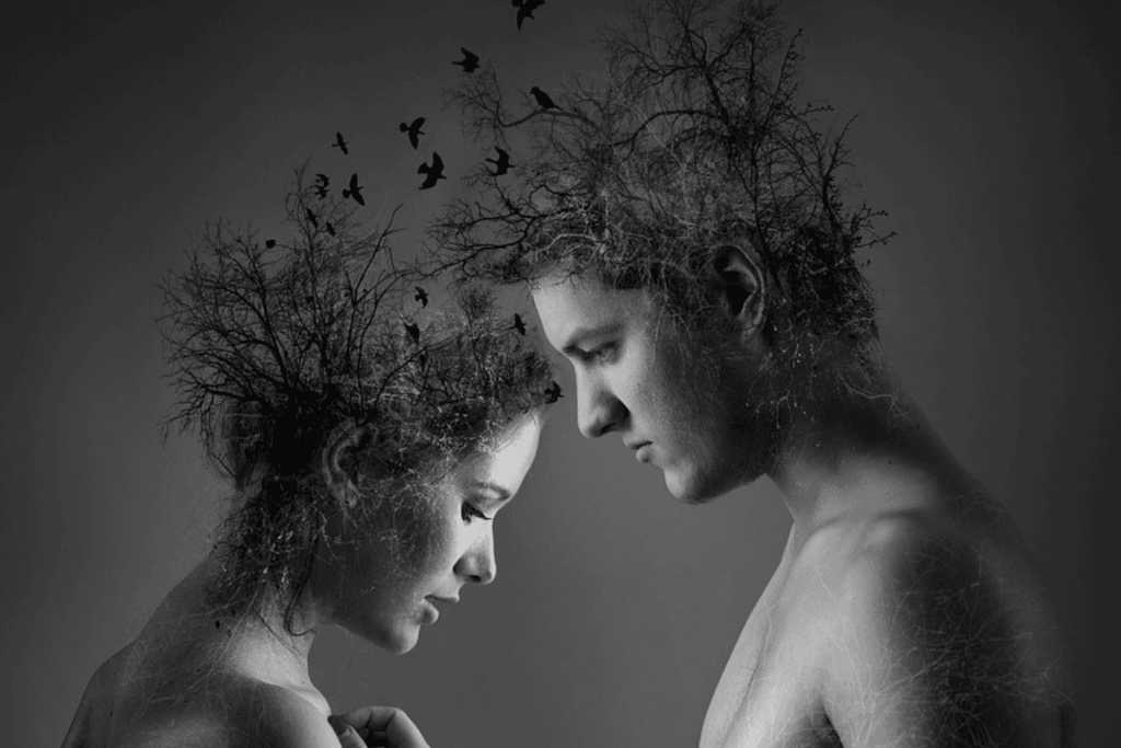 Image of a man and woman sitting apart, both appearing distant or emotionally disconnected—symbolising relationship strain and personal disconnection.