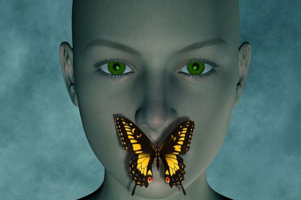 A butterfly resting gently on a woman’s mouth, symbolising quiet transformation, unspoken emotions, and the beauty that emerges from inner struggle.