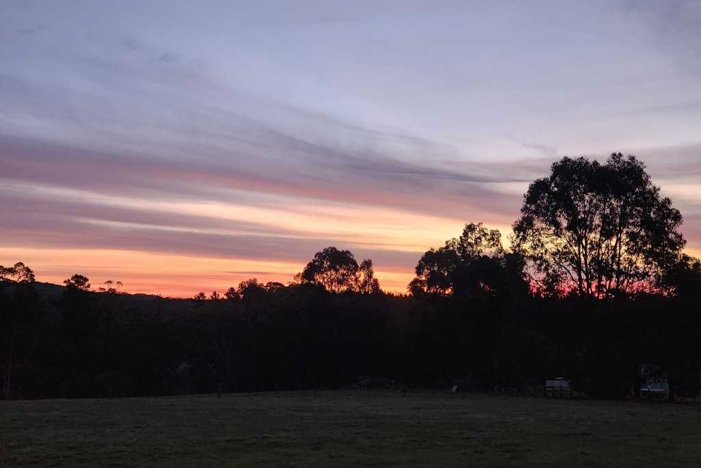 Soft evening sky over the home, creating a peaceful and reflective mood